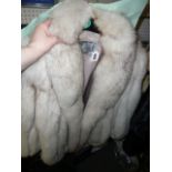 A pale platinum fox fur three-quarter length jacket with shawl collar, inset with pale blue