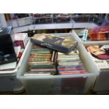 An assortment of books, videos, CDs and DVDs including The Streisand DVD collection, Marilyn