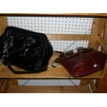 A black Bardot ladies handbag with leather trim and chain strap, and a tan leather Bardot shoulder