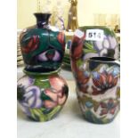 Four modern Moorcroft small vases, in generally dark colours, one decorated in Glasgow School style,