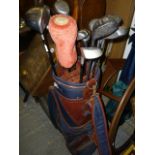 Two golf bags and clubs, including by Wilson and others by Keno and Links USA (by 858 middle aisle)