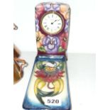 A modern Moorcroft mantel timepiece decorated with pansies, dated 1993, 6.3 ins, and a pin tray