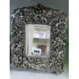 A late Victorian easel mirror with silver-plated electrotype frame decorated with fairies [P]