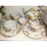A Herend porcelain breakfast set painted with  flowers, comprising teapot, milk jug, sugar bowl, two