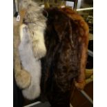 Four fur coats including musquash and squirrel, one a cape, and five assorted fur stoles and