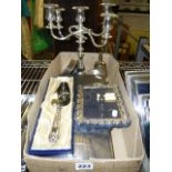 A modern silver-faced photograph frame, a silver-handled pie server, plated candelabrum, fish