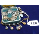A mosaic fringe necklet, a silver filigree bracelet and an antique chalcedony brooch.