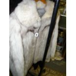 A platinum fox fur three-quarter length jacket with pale blue suede inset strips, wise collar (