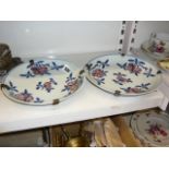 An attractive pair of 18th century Chinese porcelain dishes, each painted with four sprays of