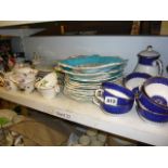 A Wedgewood blue, white and gilt part tea service including teapot, milk jug and sandwich plate, a