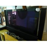 A modern Pioneer plasma flat screen television flanked by tall movable speakers (43 1/4 inches