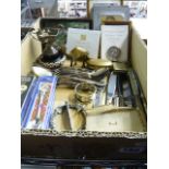 A carton containing a silver bowling club cup, a commemorative penknife, silver-plated cutlery,