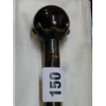 A late Victorian parasol handle, the tiger's eye ball terminal with silver mount hallmarked for