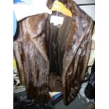 A dark brown mink fur full length coat with shawl collar, Goldwaters label and Anne Klein label (