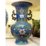 A Chinese porcelain vase, richly decorated with flowers on a powder-blue ground, seal mark of