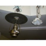 An oil light with chrome plates reservoir glass funnel and shade for ceiling suspension and a