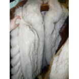 A pale platinum fox fur three-quarter length jacket with pale blue leather inset strips, Saga furs