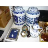 A pair of small Chinese cloisonné enamel vases with wood stands, a blue and white coffee pot, a pair