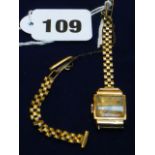 A 9ct gold watch bracelet with a square 18ct gold ladies watch.