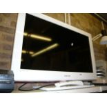 A Samsung television, with remote (G 29)