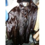 A dark brown full-length mink coat with tasselled tie-front and narrow cuffs, Philip Hockley