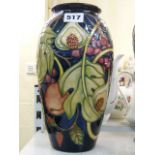A modern Moorcroft ovoid vase decorated with fruit on a blue ground, 10 ins, dated 2000 [V]