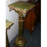 A fine and highly ornamental columnar pedestal in green onyx, marble and ormolu enriched with