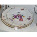 Three Herend porcelain plates painted with flowers within basket-weave borders, comprising a 19th-
