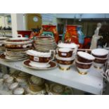 A Gladstone red and gilt decorated tea and dinner service to include meat plates, dinner plates,
