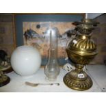 An old brass and glass oil lamp, a framed picture of an African landscape, etc. (G 33)