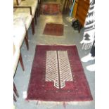 Two small pretty Eastern rugs, one a prayer rug with zigzag design on a red ground, the other with