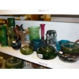 A collection of Dartmouth gurgle jugs in green and blues plus a quantity of glass ashtrays including
