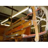 A Happi Time vintage wood and metal sled (middle aisle)