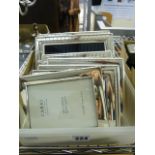 Seven modern silver-plated photograph frames.