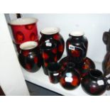 Ten pieces of Poole pottery Galaxy Living Glaze" pattern Seven black ground with orange highlights