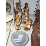 Eight Goebels Hummel figurines of children and two Wedgewood Jasperware ashtrays. (S 35)