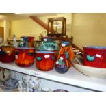 Nine pieces of Poole pottery to include two large Gemstone pattern vases and a large matching