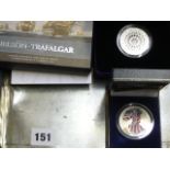 A GB 2005 silver proof Trafalgar commemorative two-crown set, a 2007 Diamond Wedding five pound