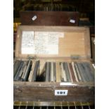 Four boxes of old glass lantern slides including humour, topographical and history, one box of