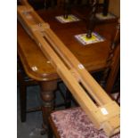 A modern hardwood artists easel, four pine canvas stretchers and a bed warmer.