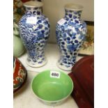 A pair of Chinese blue and white baluster vases painted with dragons, four character marks of
