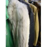 A pale platinum coloured fox fur three-quarter length jacket with pale grey suede inset strips, a