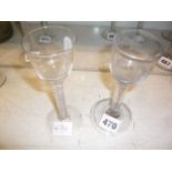 Two 18th century wine glasses, one with small ogee bowl on opaque twist stem with central muslin-