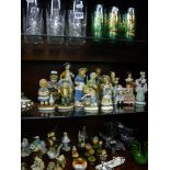 A large quantity of decorative figurines of children, birds and animals in china and glass, a set of