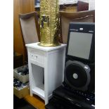 A white-painted bedside chest, brass stick-stand and contents including umbrellas and sticks, a