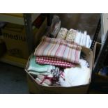 Four boxes of assorted modern bed linen, table linen and curtains, some new and in packets,