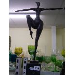 A Talos Gallery bronze of a stylised female nude on one leg, signed milo, dark base, 20.5 (M)"