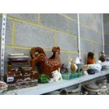 Four shelves of china and general wares to include duck and hen egg crooks, dinner casserole dishes,