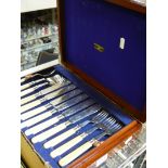 An Edwardian set of plated fish eaters for twelve with ivory handles, in mahogany case.