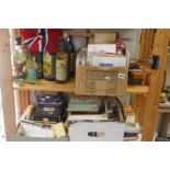 Three shelves of various items including greetings cards, sewing items, buttons, brass